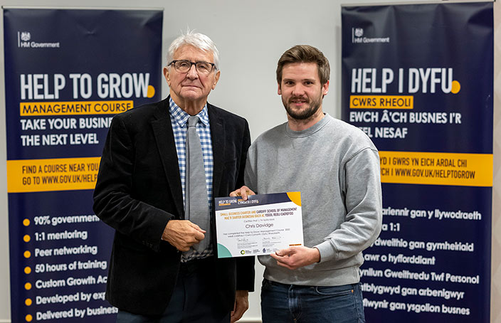 Chris Davidge shaking hands with Brian Morgan for the Help to Grow final session for cohort 2.